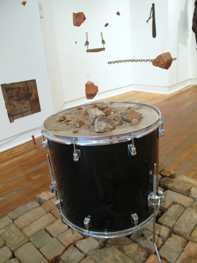 A sane revolution, bricks, drum, fish wire, copper thread, 144" x 53" x 53"