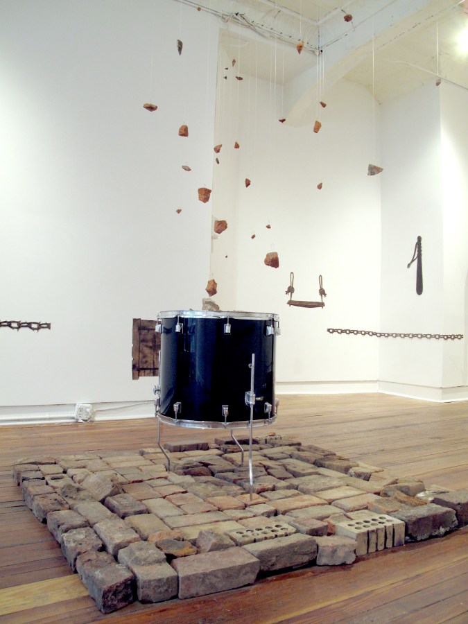 A sane revolution, bricks, drum, fish wire, copper thread, 144" x 53" x 53"